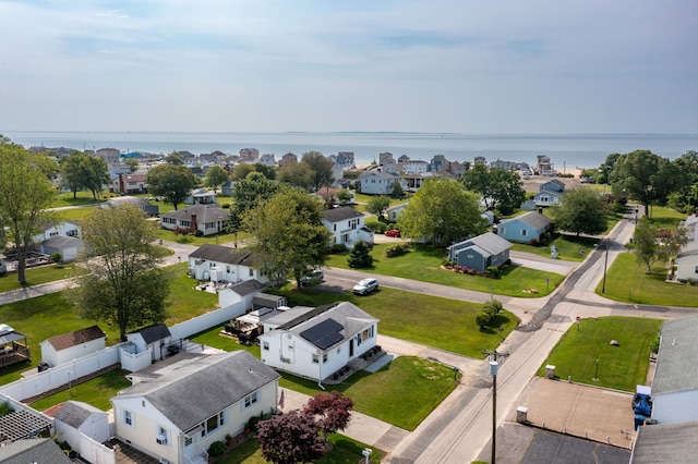 aerial view of residential area with a nearby body of water
