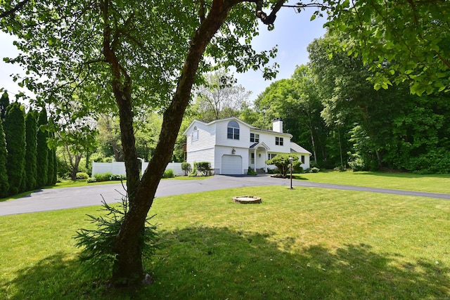118 Putnam Rd, Pomfret, CT 06259 - view of front of property with asphalt driveway, a garage, and a chimney