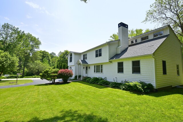 118 Putnam Rd, Pomfret, CT 06259 - rear view of property with a chimney, a yard, and a shingled roof