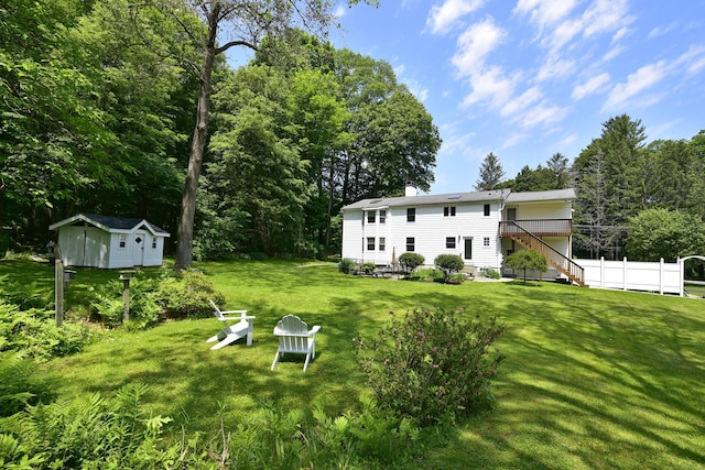 118 Putnam Rd, Pomfret, CT 06259 - view of green lawn with stairs and a wooden deck