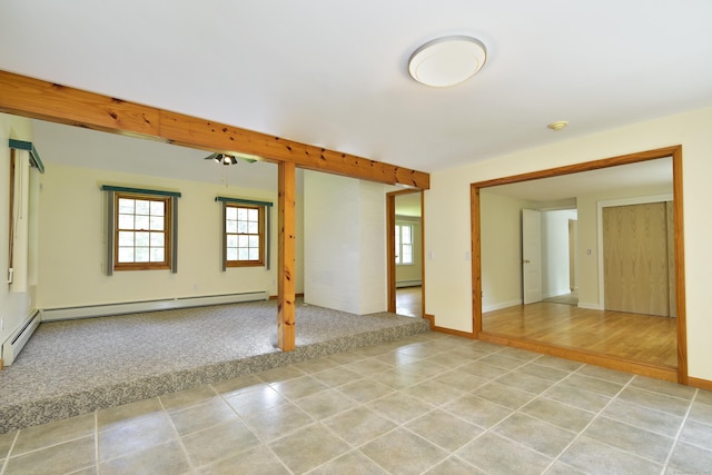 118 Putnam Rd, Pomfret, CT 06259 - empty room featuring plenty of natural light, light tile patterned flooring, baseboard heating, and baseboards