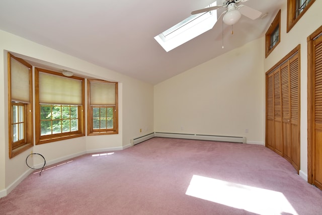 118 Putnam Rd, Pomfret, CT 06259 - unfurnished bedroom featuring light colored carpet, baseboard heating, lofted ceiling, a skylight, and two closets