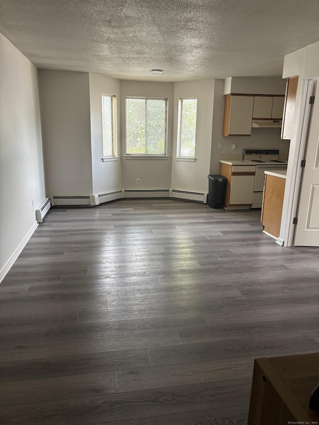5 Fales St Apt 101, Hartford, CT 06105 - unfurnished living room with a textured ceiling, dark wood-type flooring, and baseboards