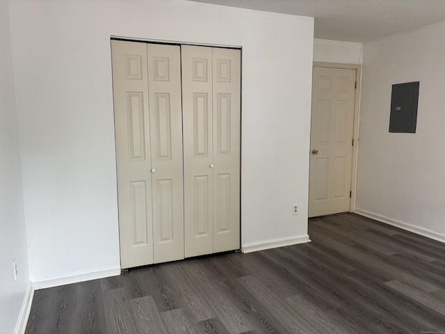 5 Fales St Apt 101, Hartford, CT 06105 - unfurnished bedroom with electric panel, dark wood finished floors, a closet, and baseboards