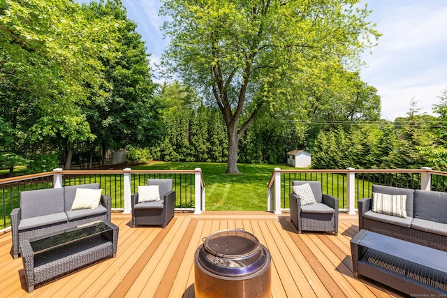 100 Grandview St, Manchester, CT 06040 - deck featuring an outdoor living space with a fire pit, a lawn, and view of scattered trees