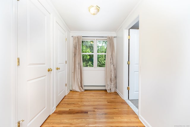 100 Grandview St, Manchester, CT 06040 - hallway featuring light wood-type flooring, a baseboard radiator, crown molding, and baseboards