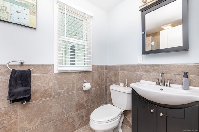 100 Grandview St, Manchester, CT 06040 - bathroom featuring vanity, wainscoting, tile walls, and toilet