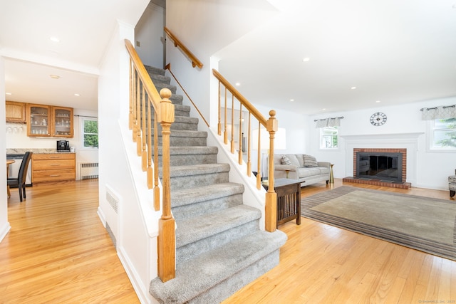 100 Grandview St, Manchester, CT 06040 - stairway with radiator heating unit, plenty of natural light, wood finished floors, and recessed lighting