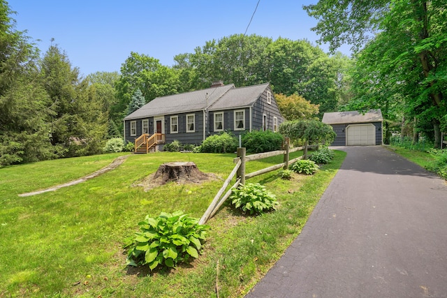 2 Stowe Pl, Trumbull, CT 06611 - view of front of home featuring an outbuilding, driveway, a chimney, a front lawn, and a detached garage