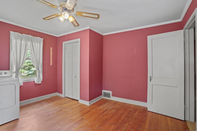 2 Stowe Pl, Trumbull, CT 06611 - unfurnished bedroom with washer / clothes dryer, light wood finished floors, crown molding, a closet, and a ceiling fan