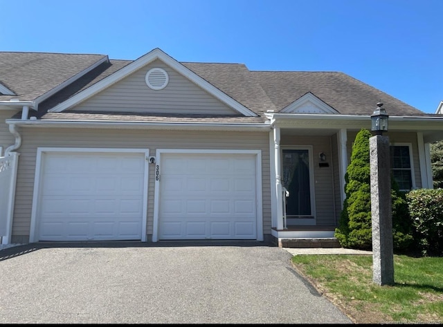 123 Meadow Brook Rd Unit 123, Oxford, CT 06478 - view of front facade with a garage, asphalt driveway, and roof with shingles