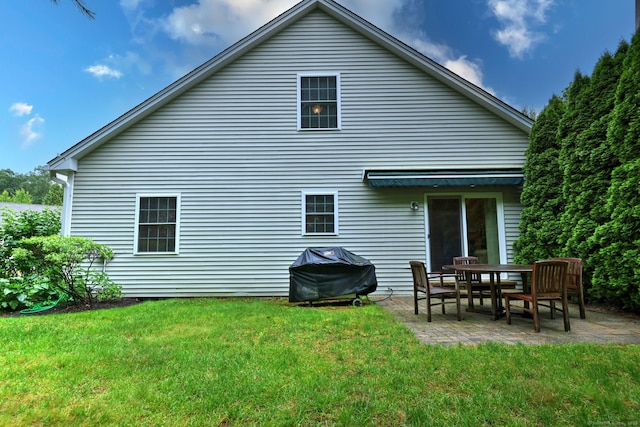 123 Meadow Brook Rd Unit 123, Oxford, CT 06478 - rear view of property featuring a patio and a lawn