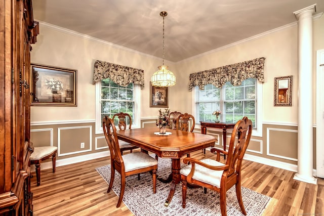 123 Meadow Brook Rd Unit 123, Oxford, CT 06478 - dining room featuring light wood-type flooring, ornate columns, healthy amount of natural light, crown molding, and a wainscoted wall