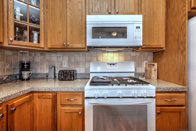 123 Meadow Brook Rd Unit 123, Oxford, CT 06478 - kitchen featuring white appliances, glass insert cabinets, backsplash, and brown cabinets
