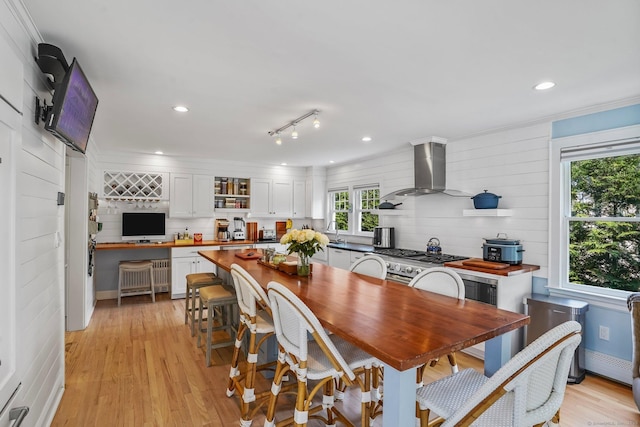 185 Lovers Ln, Fairfield, CT 06824 - dining room featuring healthy amount of natural light, light wood-style floors, recessed lighting, and ornamental molding