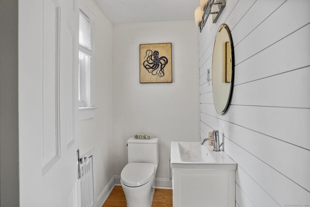 185 Lovers Ln, Fairfield, CT 06824 - bathroom featuring vanity, wood finished floors, and radiator