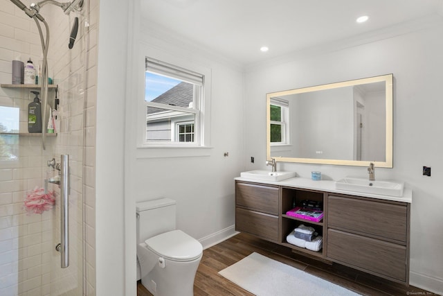 185 Lovers Ln, Fairfield, CT 06824 - full bathroom featuring crown molding, double vanity, a shower stall, wood finished floors, and recessed lighting