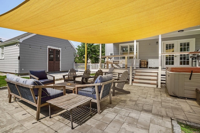 185 Lovers Ln, Fairfield, CT 06824 - view of patio featuring a hot tub, french doors, and an outdoor hangout area
