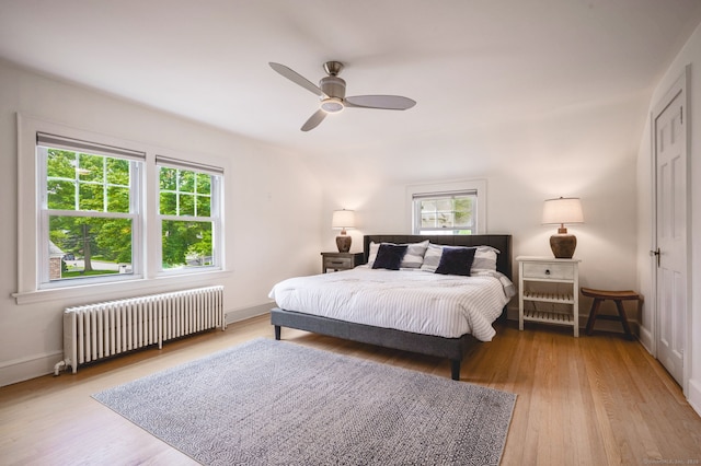 185 Lovers Ln, Fairfield, CT 06824 - bedroom featuring radiator, wood finished floors, and ceiling fan