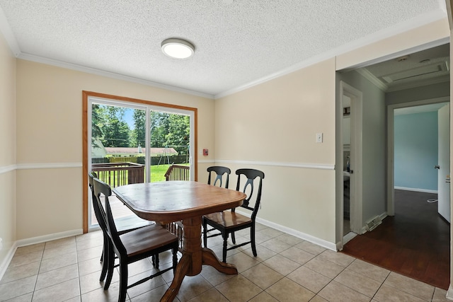 26 Paula Rd, East Haddam, CT 06423 - dining space with light tile patterned floors, crown molding, and a textured ceiling