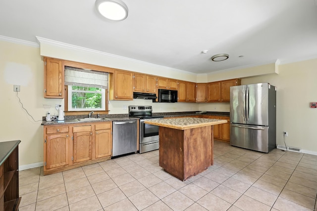 26 Paula Rd, East Haddam, CT 06423 - kitchen with appliances with stainless steel finishes, under cabinet range hood, ornamental molding, a kitchen island, and light tile patterned flooring