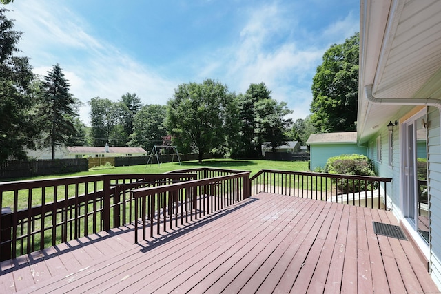 26 Paula Rd, East Haddam, CT 06423 - deck with a fenced backyard, a playground, and view of wooded area