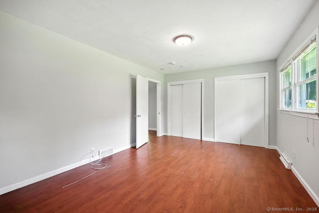 26 Paula Rd, East Haddam, CT 06423 - unfurnished bedroom featuring two closets and wood finished floors