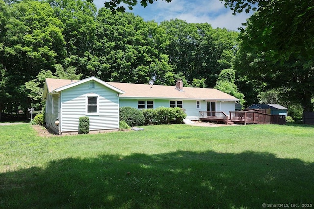 26 Paula Rd, East Haddam, CT 06423 - rear view of house featuring a deck, a lawn, and a chimney