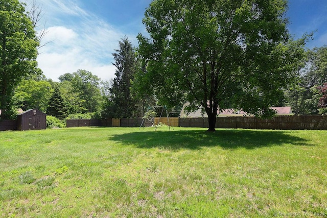 26 Paula Rd, East Haddam, CT 06423 - fenced backyard featuring a storage unit