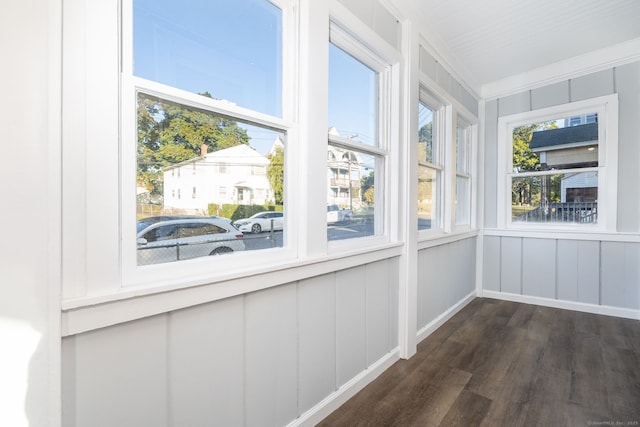 57 Wilson St, New Britain, CT 06051 - unfurnished sunroom featuring wood finished floors and a decorative wall