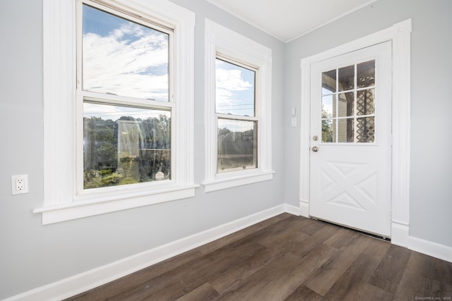 57 Wilson St, New Britain, CT 06051 - doorway featuring dark wood-type flooring, baseboards, and crown molding