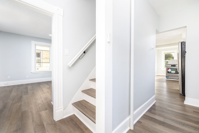 57 Wilson St, New Britain, CT 06051 - staircase featuring wood finished floors and baseboards