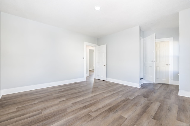 57 Wilson St, New Britain, CT 06051 - empty room featuring wood finished floors, baseboards, and recessed lighting