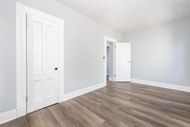 57 Wilson St, New Britain, CT 06051 - unfurnished bedroom featuring wood finished floors and baseboards