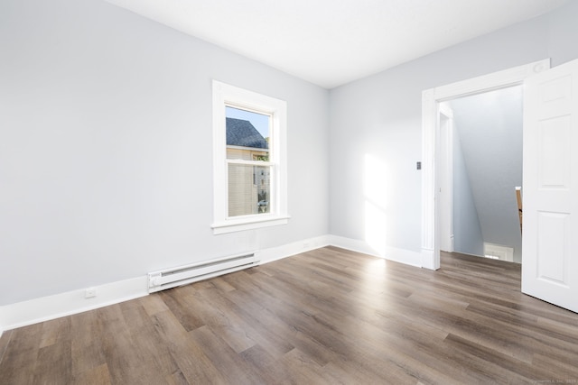 57 Wilson St, New Britain, CT 06051 - empty room with a baseboard radiator, wood finished floors, and baseboards
