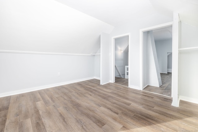 57 Wilson St, New Britain, CT 06051 - additional living space with vaulted ceiling, wood finished floors, and baseboards