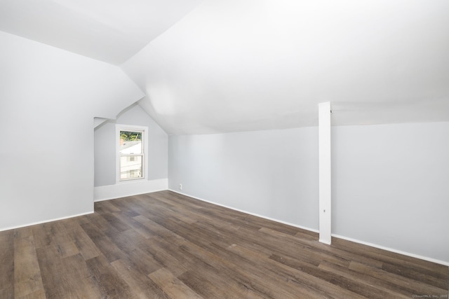 57 Wilson St, New Britain, CT 06051 - bonus room with dark wood-type flooring, vaulted ceiling, and baseboards