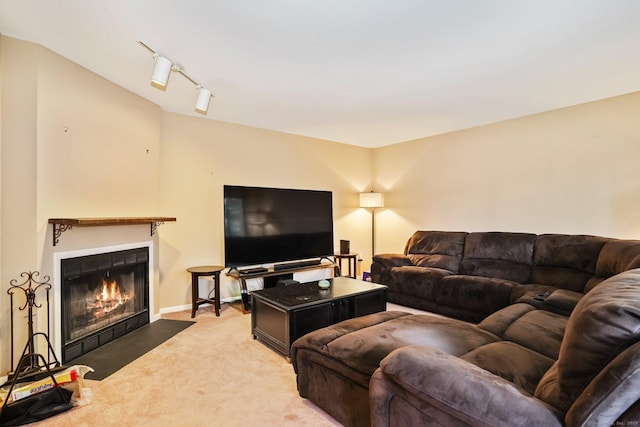 2437 Bedford St Unit E5, Stamford, CT 06905 - carpeted living room featuring a fireplace with flush hearth, track lighting, and baseboards