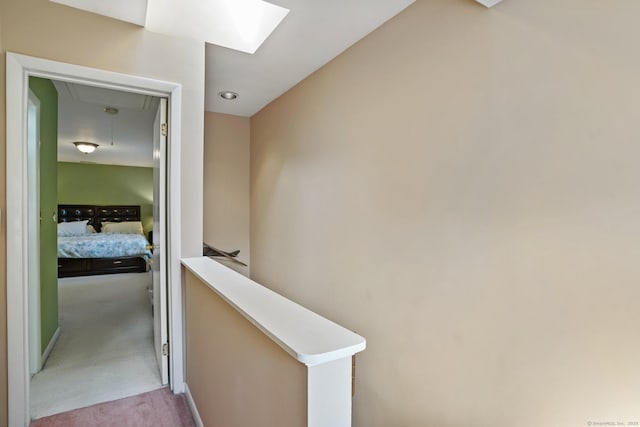 2437 Bedford St Unit E5, Stamford, CT 06905 - hall with attic access, carpet, an upstairs landing, and a skylight