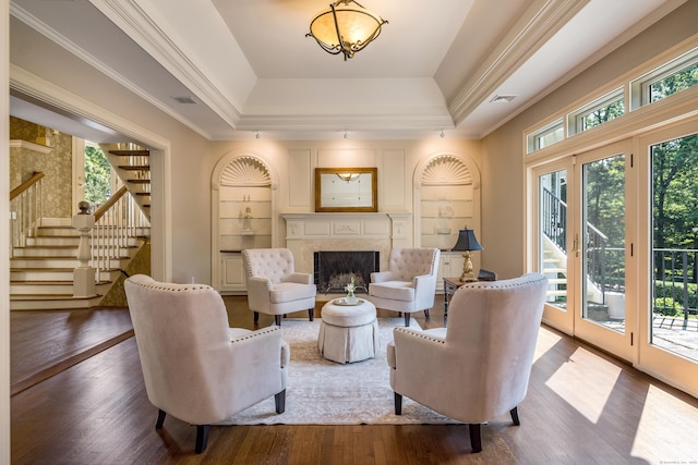 15 NE Rd, Farmington, CT 06032 - living room featuring a tray ceiling, stairway, wood finished floors, a premium fireplace, and crown molding