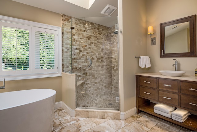 15 NE Rd, Farmington, CT 06032 - bathroom featuring a shower stall, a soaking tub, vanity, and healthy amount of natural light