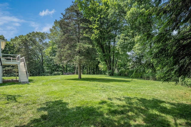 15 NE Rd, Farmington, CT 06032 - view of green lawn featuring stairway and a wooden deck