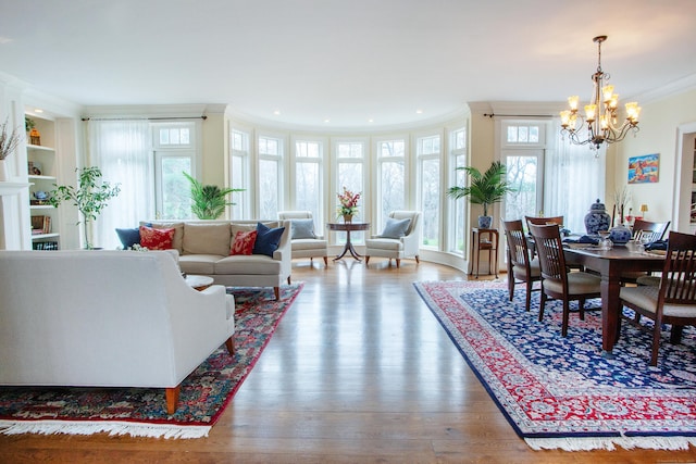 3 Ridgebury Rd, Simsbury, CT 06001 - living area featuring crown molding, a chandelier, wood finished floors, and recessed lighting