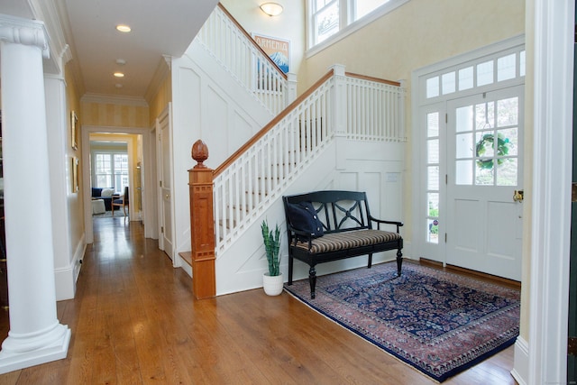 3 Ridgebury Rd, Simsbury, CT 06001 - entrance foyer with healthy amount of natural light, stairs, wood finished floors, crown molding, and a high ceiling