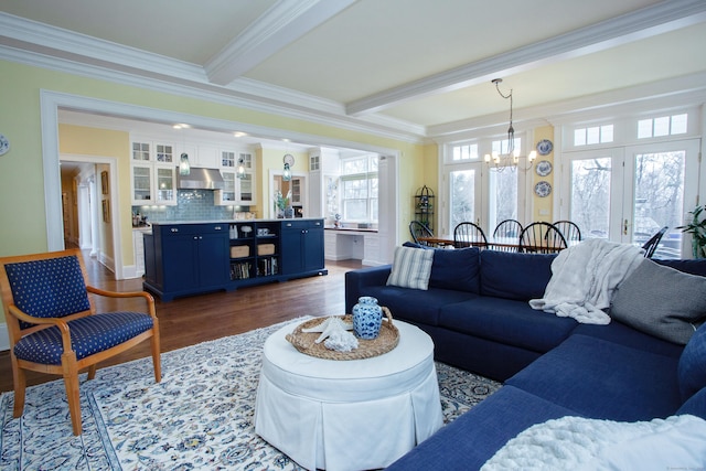 3 Ridgebury Rd, Simsbury, CT 06001 - living area featuring a chandelier, ornamental molding, wood finished floors, and beam ceiling