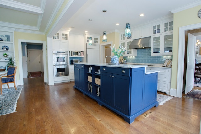 3 Ridgebury Rd, Simsbury, CT 06001 - kitchen featuring under cabinet range hood, blue cabinets, stainless steel appliances, white cabinetry, and light countertops
