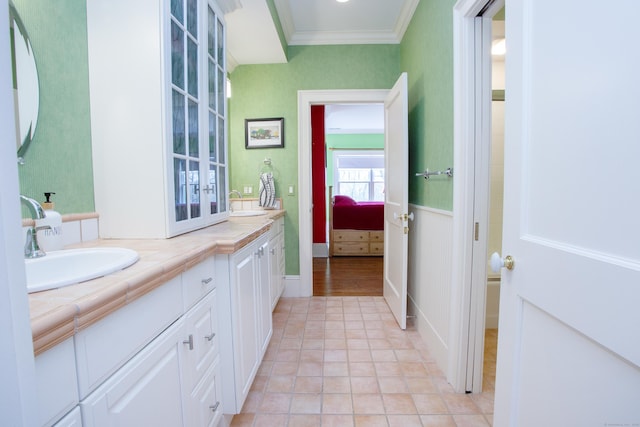 3 Ridgebury Rd, Simsbury, CT 06001 - ensuite bathroom featuring double vanity, crown molding, tile patterned floors, and french doors