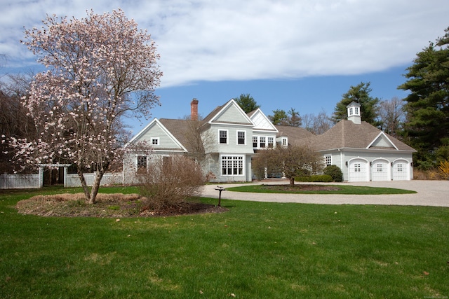 3 Ridgebury Rd, Simsbury, CT 06001 - shingle-style home featuring a front lawn, driveway, and a chimney
