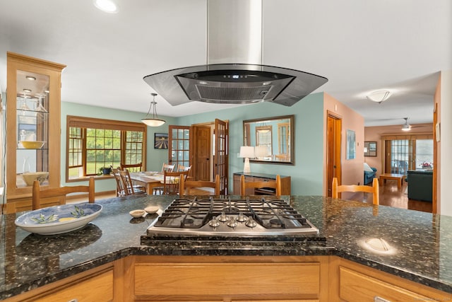 101 Overton Farm Dr, Southbury, CT 06488 - kitchen with stainless steel gas cooktop, island exhaust hood, healthy amount of natural light, and decorative light fixtures