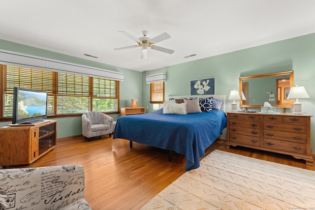 101 Overton Farm Dr, Southbury, CT 06488 - bedroom featuring wood finished floors, ceiling fan, and a wall unit AC